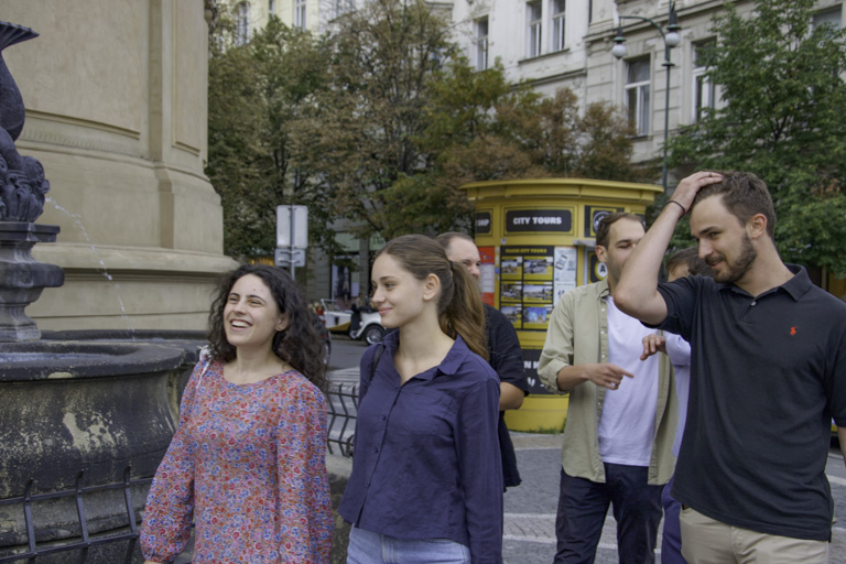 Teams running around Prague, doing team building activities